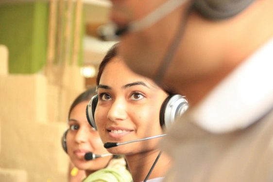 two-women-wearing-headsets-in-a-bright-office-workspace.jpg Two women wearing headsets in a bright office workspace